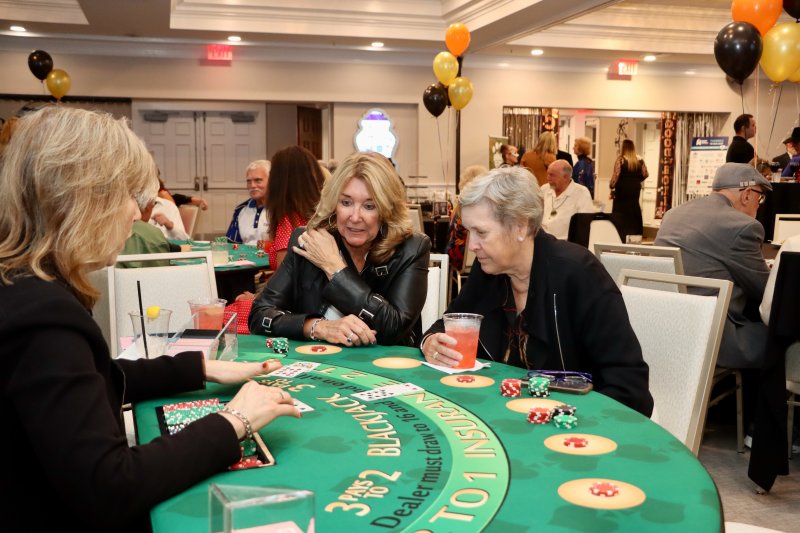 Jackie Blue, left, and Dot Filbert try their luck at the blackjack table during Humane Animal Partners’ fourth annual Casino Night fundraiser Oct. 30 at Baywood Greens. The proceeds support services for rescue dogs and cats at HAP’s Rehoboth Beach and New Castle County facilities. BILL SHULL PHOTOS